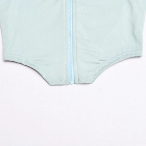 Detailed close-up of light blue two-piece set hem with durable zipper and double stitching