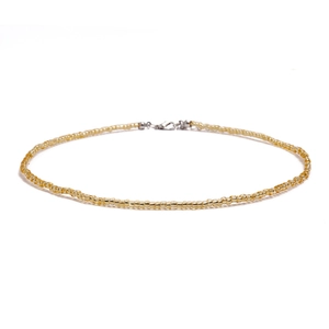 Close-up of bohemian gold seed bead choker necklace with lobster clasp and extender