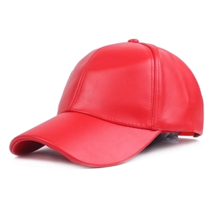 Detailed view of red PU leather baseball cap showing curved brim and texture