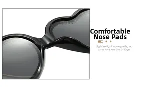 Detail of the comfortable integrated nose pads on black heart-shaped sunglasses
