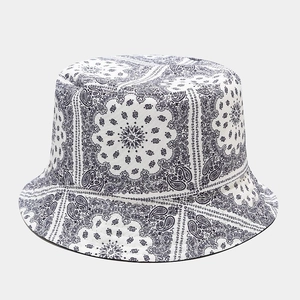Close-up detail of paisley pattern stitching on cotton sun bucket hat in blue and white