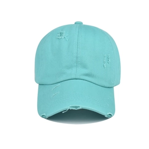 Close-up of mint green washed cotton baseball cap with distressed torn fabric details