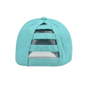 Close-up of the unique criss-cross elastic ponytail hole on a mint washed cotton baseball cap