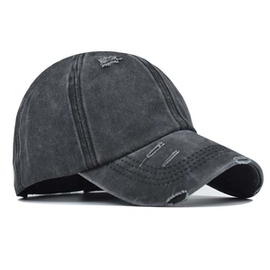 Vintage washed charcoal ponytail baseball cap with distressed details on the brim and crown