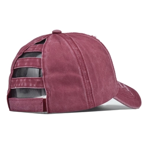 Detail view of burgundy washed cotton ponytail baseball cap with back cutout structure