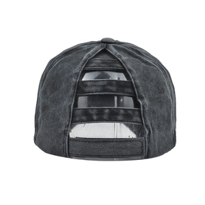 Close-up of ponytail opening and adjustable velcro strap on washed cotton baseball cap
