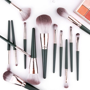 Professional 12-piece dark green makeup brush set with rose gold metal ferrules