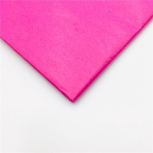 Close-up of pink laser glitter floral wrapping paper with subtle textured finish