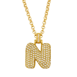 Macro shot of bubble letter N pendant necklace in 18K gold with pave cubic zirconia stones