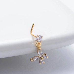 L-shaped gold nose stud with sparkling butterfly zircon pendant on white background