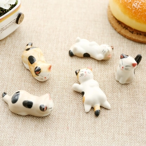 Set of 5 Japanese-style ceramic cat chopstick rests in various sleeping poses
