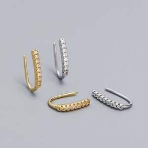 Elegant gold and silver U-shaped ear cuffs with micro-paved zircons for a minimalist look