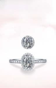 Macro detail of oval cut zircon ring with halo setting and pave stones on silver band