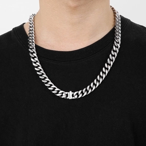 Polished silver cuban link chain necklace worn on model for a street style look