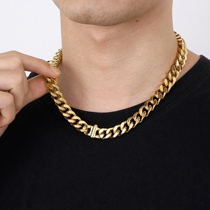 18K gold plated 12mm Cuban link chain necklace in stainless steel worn by a male model