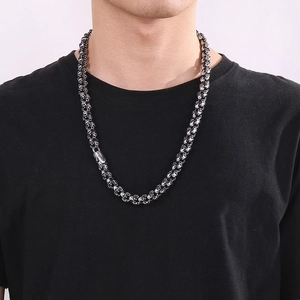 Vintage punk skull pendant necklace with intricate woven chain design for men and women