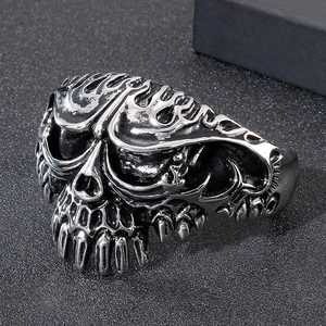 Macro shot of vintage skull design on stainless steel open cuff bracelet with dark finish