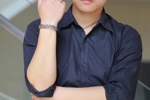 Male model wearing vintage rose pattern stainless steel chain bracelet with silver finish