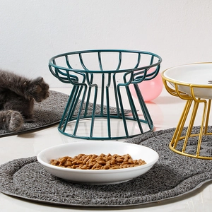 Elevated ceramic pet bowl with gold metal stand and grey mat for cat neck protection