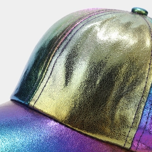 Macro shot of colorful iridescent laser baseball cap with metallic crinkle texture
