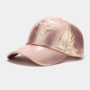 Detail of rose gold PU baseball cap showing metallic crinkle texture and stitching