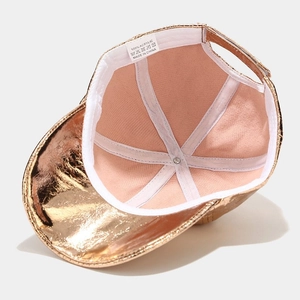 Detail of baseball cap interior showing pink fabric lining and care label information