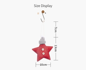 Size display of a red felt Christmas star ornament with a grey knit hat and hanging rope