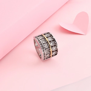 Wide 304 stainless steel ring with gold line and multi-row zircon inlay on pink background