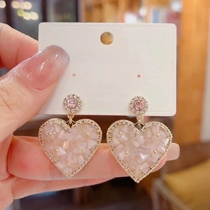 Elegant gold-tone heart earrings with pink crystals and micro-pave rhinestones