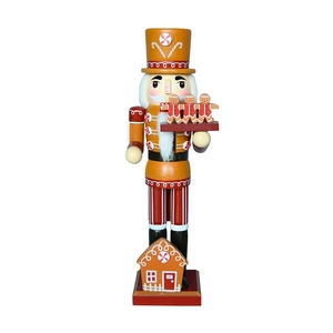 Gingerbread nutcracker chef figure with house base and cookie tray holiday decor