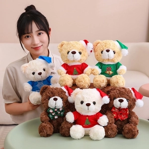 Detailed view of six Christmas teddy bears in red and green festive outfits for gifting