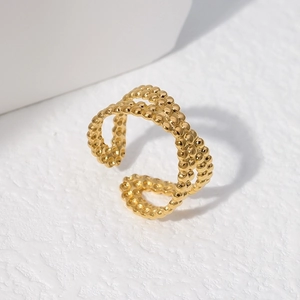 Detailed view of golden double-layer beaded texture ring with adjustable open design