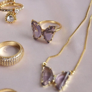 Gold plated open ring and necklace set with purple crystal butterfly and zircon accents