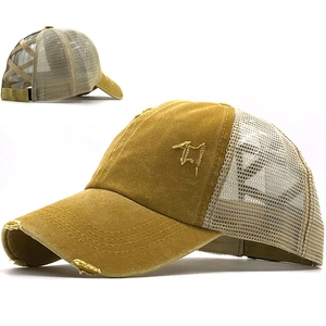 Detail of washed mustard yellow baseball cap with criss-cross bands for high pony tails