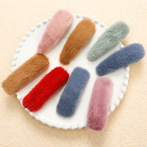 Set of 8 colorful plush hair clips for women in soft faux fur with a drop shape design
