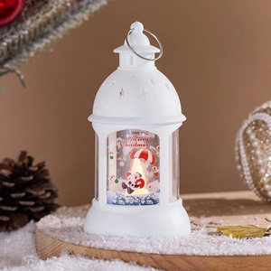 White Christmas lantern detail with Santa illustration and glowing warm light
