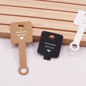 Three-color paper display cards with Handmade with love text for jewelry and hair ties