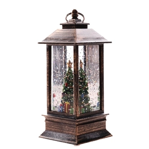 Vintage bronze Christmas lantern featuring miniature trees and festive gift boxes