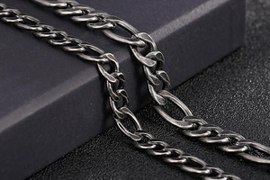 Macro shot of retro stainless steel chain with vintage finish on black gift box