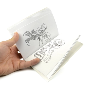Close-up of hand holding a magic coloring book with cartoon clown illustrations