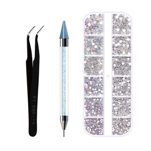 Detail of professional nail art set with dual-ended wax pen, ESD-15 tweezers, and rhinestones