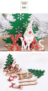 Detail of DIY wooden Christmas sleigh decoration with XMAS letters and Santa Claus figure