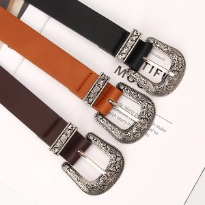 Women's vintage leather belts with engraved metal buckles in black and brown colors