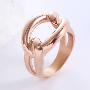 Minimalist hollow knot open ring in rose gold finish on a clean grey background