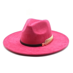 Fuchsia suede jazz hat with wide flat brim, black band and decorative gold metal leaves