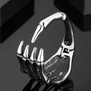 Vintage silver skeleton hand ring in titanium steel with a gothic skull claw design