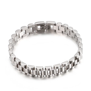 Macro view of polished silver stainless steel links and clasp on a metal watch band