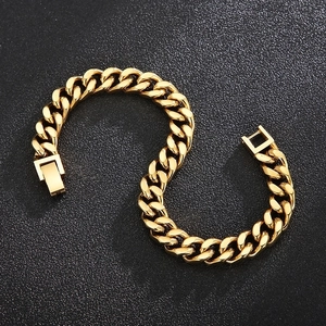 Detailed view of heavy gold-plated Cuban link chain with secure square box clasp