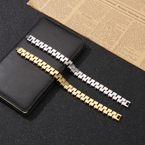 Close-up of gold and silver Z-shape titanium steel bracelets on a vintage background