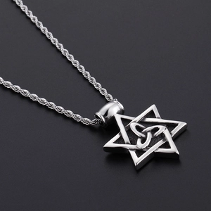 Macro detail of silver punk hexagram pendant with Celtic knot on a twisted rope chain